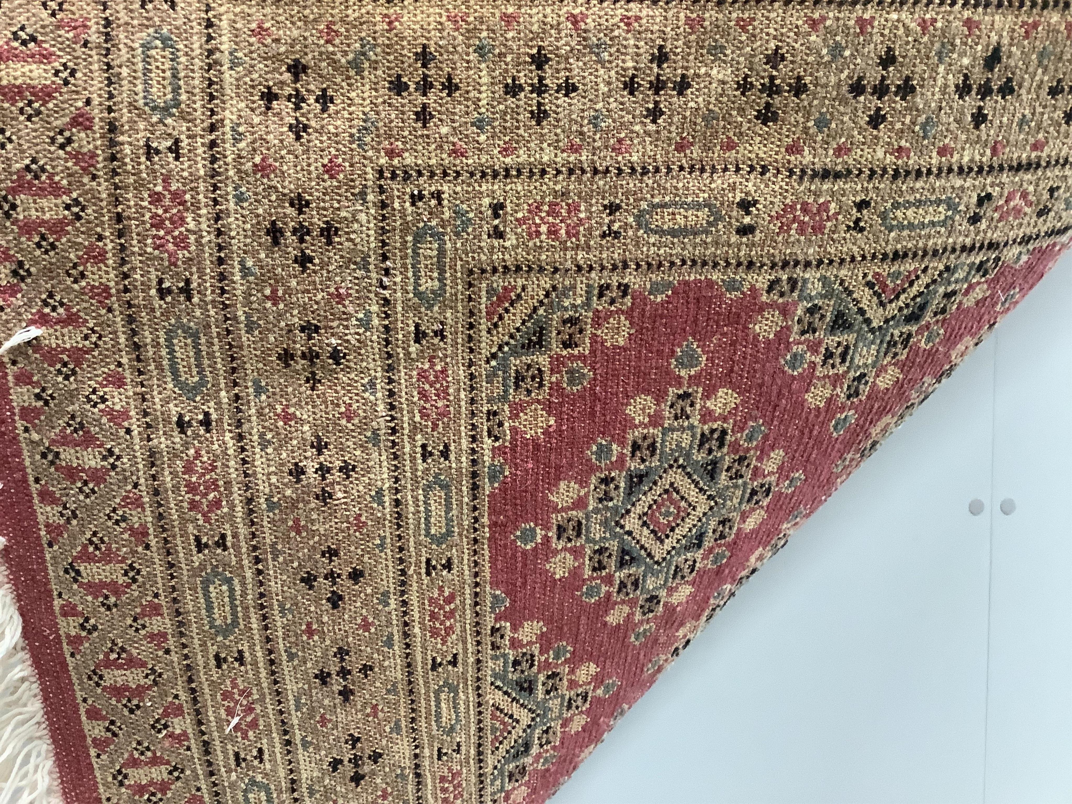 A Hamadan red ground rug, 150 x 108cm together with a North West Persian style rug and an Afghan runner. Condition - fair